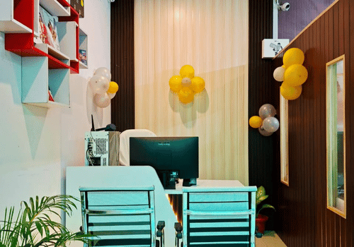 Wide view of the client discussion and gallery wall at Click Photography